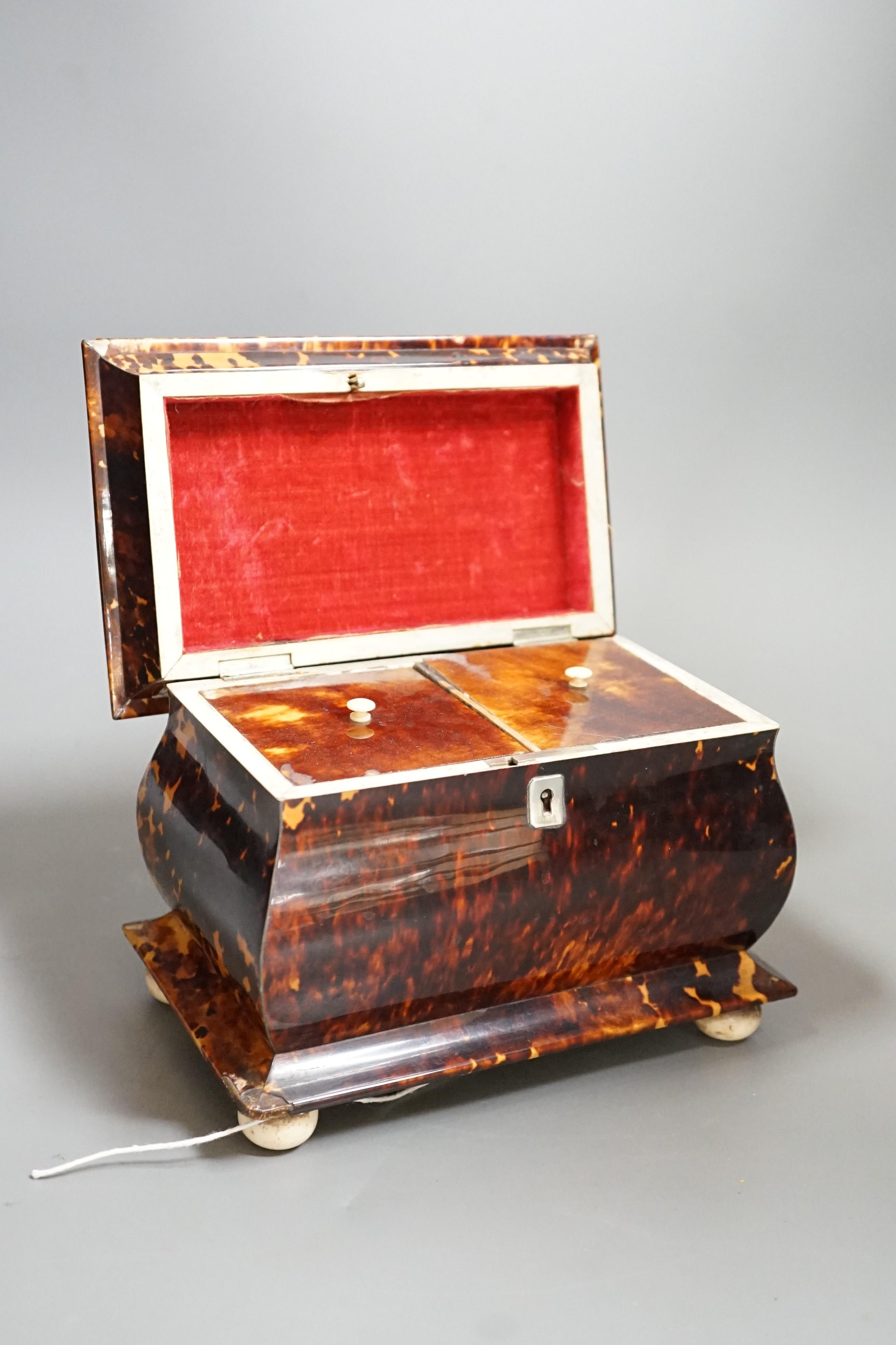 A Victorian tortoiseshell and ivory mounted tea caddy, 18cms high